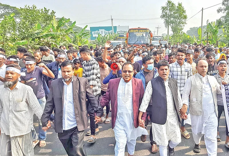 Supporters of 'boat' candidate of Cumilla-1 constituency Abdus Sabur bring out a procession that created a huge traffic jam on Dhaka-Chattogram highway, known as lifeline of Bangladesh's economy, on 27 December in 2023