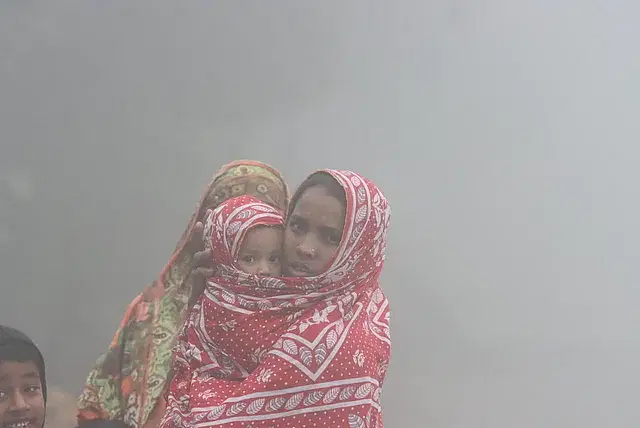 A mother wraps her child with her sari in the biting cold. The picture was taken from Horirampiroj area of Rangpur on 10 December.