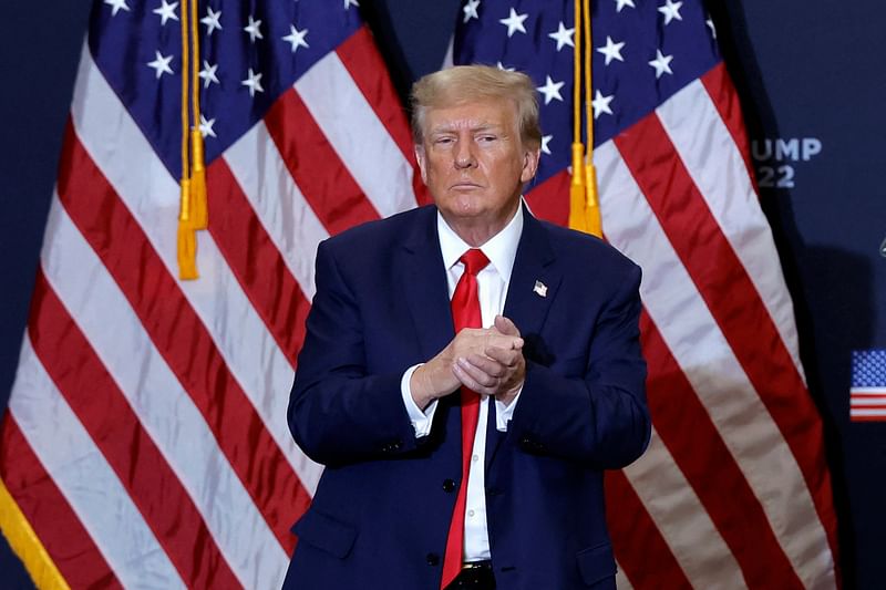 Former US President and 2024 presidential hopeful Donald Trump gestures at the end of a campaign event in Waterloo, Iowa, on 19 December, 2023