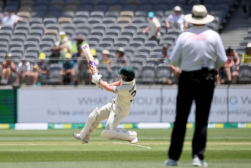 Australia’s David Warner plays a shot against Shaheen Shah Afridi during the first day of the first Test cricket match between Australia and Pakistan at Optus Stadium in Perth on 14 December, 2023