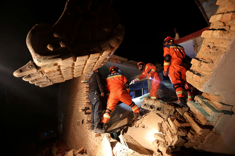 Rescue workers conduct search and rescue operations at Kangdiao village following the earthquake in Jishishan county, Gansu province, China on 19 December 2023.