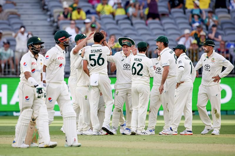 Pakistan’s Shan Masood and Imam-ul-Haq walks off after being caught by Australia’s Alex Carey during the second day of the first Test cricket match between Australia and Pakistan in Perth on 15 December, 2023