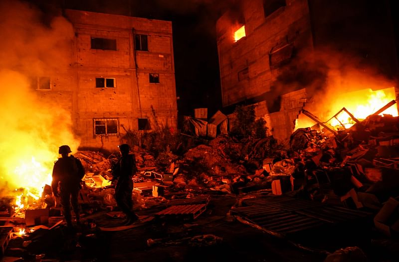 This picture taken on 20 December, 2023, shows Israeli soldiers during a military operation in the north of the Gaza Strip amid continuing battles between Israel and the Palestinian militant group Hamas