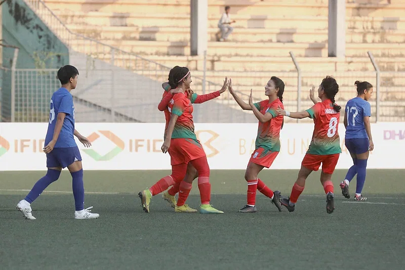 Bangladesh women football team celebrate a goal against Singapore at Bir Shrestha Shahid Shipahi Mustofa Kamal Stadium in Dhaka on 1 December in 2023