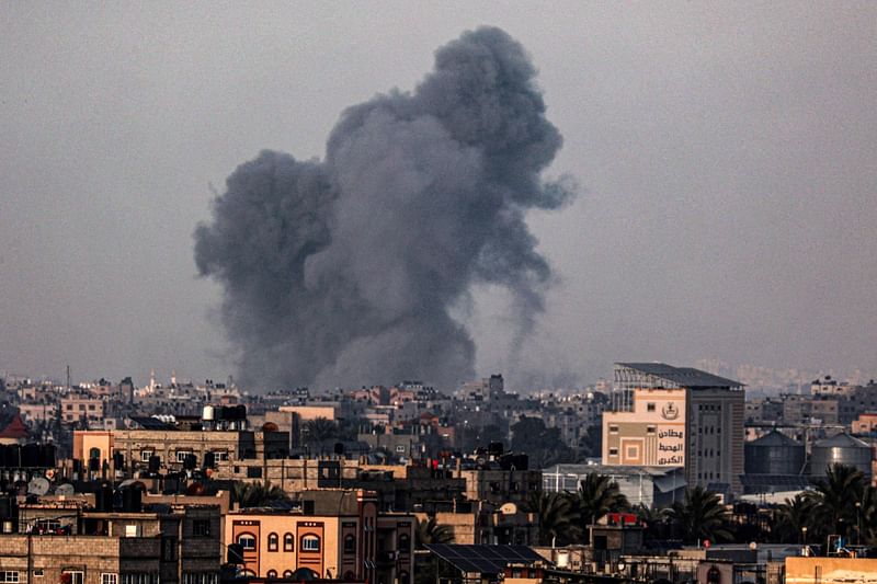 This picture taken on 18 January, 2024 from Rafah shows smoke billowing over Khan Yunis in the southern Gaza Strip during Israeli bombardment, amid ongoing battles between Israel and the Palestinian militant group Hamas