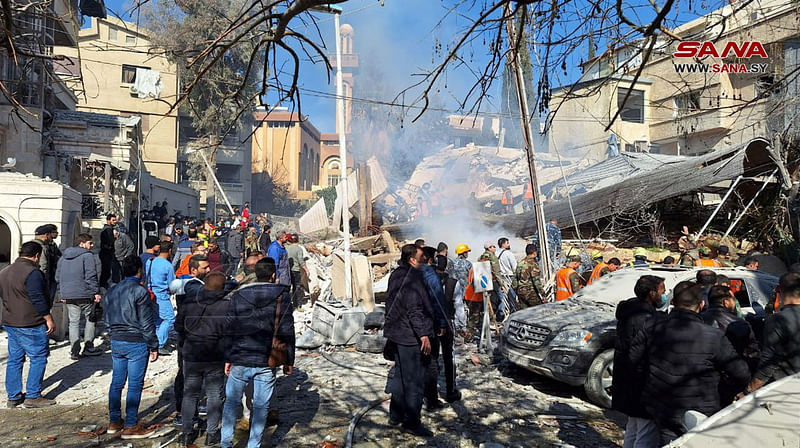 People inspect the damage at the site of an Israeli strike, according to sources, in the Mazzeh neighborhood of Damascus, Syria January 20, 2024