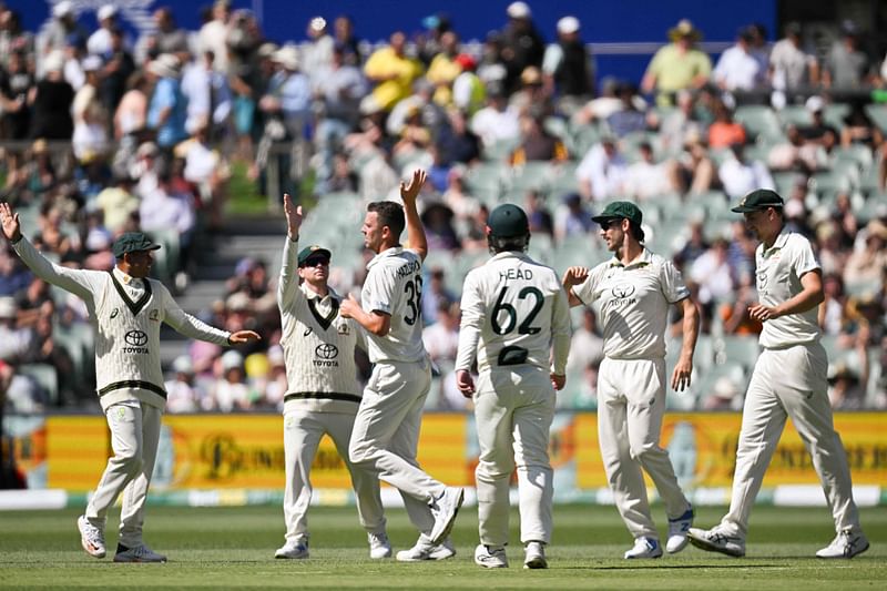 Australia’s Josh Hazlewood (3rd L) celebrates with teammates taking the wicket of West Indies’ Alick Athanaze during day two of the first cricket Test match between Australia and the West Indies at the Adelaide Oval in Adelaide on 18 January, 2024