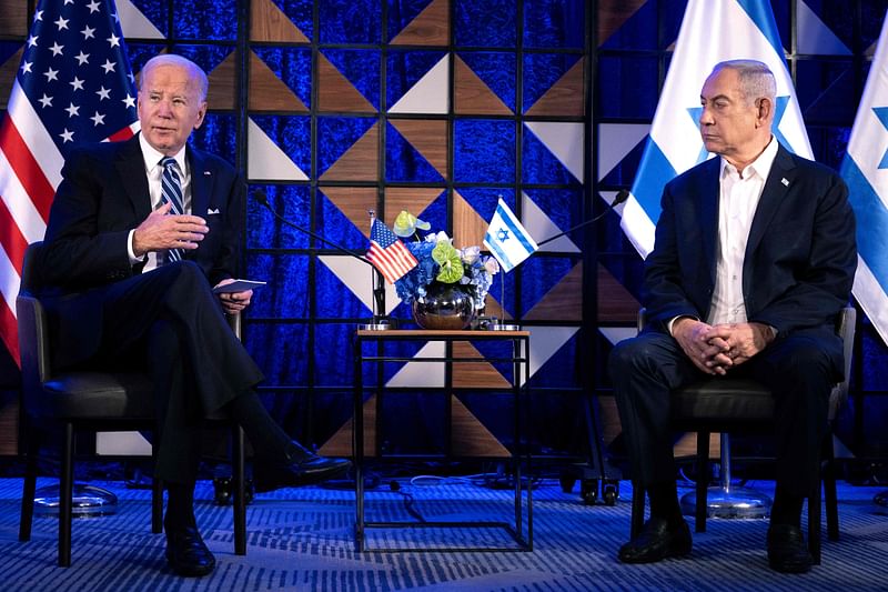 US President Joe Biden (L) speaks as Israel's Prime Minister Benjamin Netanyahu listens on prior to their meeting in Tel Aviv on 18 October, 2023, amid the ongoing battles between Israel and the Palestinian group Hamas. US President Joe Biden pushed Israeli Prime Minister Benjamin Netanyahu on 19 January, 2024 on the need for future Palestinian statehood, as the two leaders spoke for the first time in a month amid tensions over plans for the aftermath of the Gaza war.