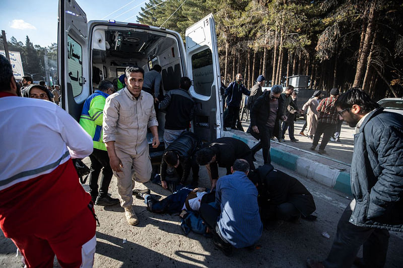 Iranian emergency services arrive at the site where two explosions in quick succession struck a crowd marking the anniversary of the 2020 killing of Guards general Qasem Soleimani, near the Saheb al-Zaman Mosque in the southern Iranian city of Kerman on January 3, 2024.