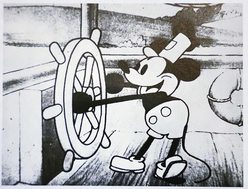 In this photo illustration, a still from Disney's 'Steamboat Willie' that was the debut of Mickey Mouse is seen in a book on 3 January, 2024 in Glendale, California