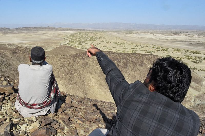 A local resident shows a mountain at the Koh-e-Sabz area of Pakistan's south-west Baluchistan province where Iran launched an airstrike, on 18 January, 2024.