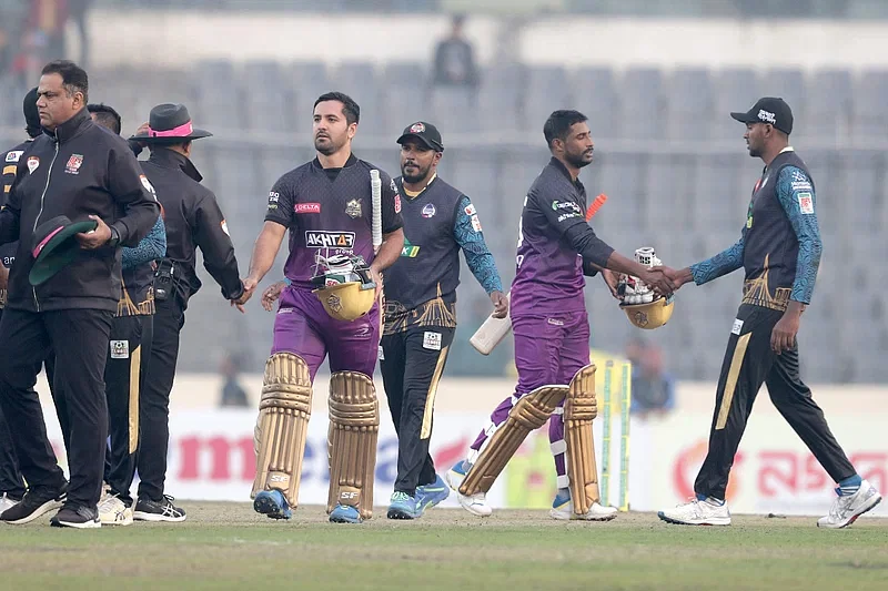 Players of Chattogram Challengers and Durdanto Dhaka shake hands after the BPL match at Sher-e-Bangla National Cricket Stadium on 22 January in 2024