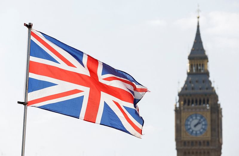 Britain's national flag flies next to Big Ben in London, Britain, 23 March 2022.