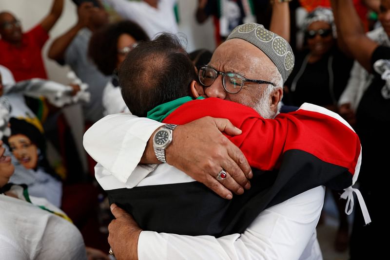 Pro-Palestinian supporters react in celebration after watching the International Court of Justice (ICJ) delivering its decision following a hearing of the case against Israel brought by South Africa in The Hague at the Embassy of Palestine in Pretoria on 26 January, 2024 South African lawyers presented their case at the UN’s top court in The Hague, where South Africa lodged an urgent appeal to force Israel to “immediately suspend” its military operations in Gaza