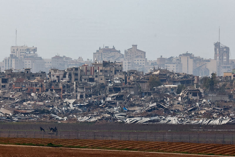 Buildings lie in ruin in Gaza, amid the ongoing conflict between Israel and the Palestinian Islamist group Hamas, as seen from Israel, January 14, 2024