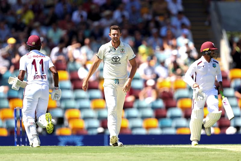 Australia’s Josh Hazlewood (C) looks on during day one of the second cricket Test match between Australia and West Indies at The Gabba in Brisbane on 25 January, 2024