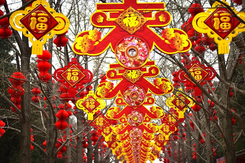 Visitors are visiting Ditan Park, which is decorated for the Spring Festival temple fair, in Beijing, China, on 30 January, 2024