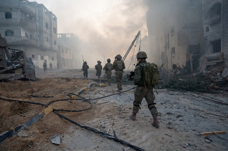 Israeli soldiers operate in the Gaza Strip amid the ongoing conflict between Israel and the Palestinian Islamist group Hamas, in this handout picture released on 21 January, 2024