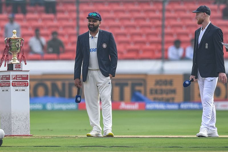 India’s captain Rohit Sharma and his England’s counterpart Ben Stokes (R) look on during the toss before the start of the first day of the first Test cricket match between India and England at the Rajiv Gandhi International Stadium in Hyderabad on 25 January, 2024