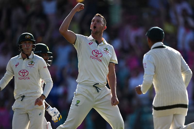 Australia’s Josh Hazlewood (C) celebrates taking the wicket of Pakistan’s Sajid Khan during day three of the third cricket Test match between Australia and Pakistan at the Sydney Cricket Ground on 5 January, 2024