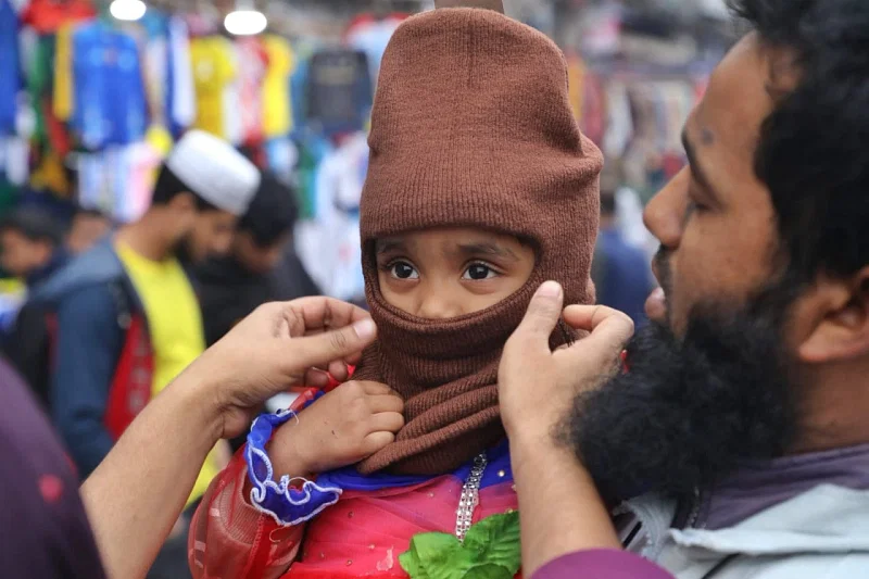 A cap has been bought for the child. People are thronging Gulistan to buy warm clothes.