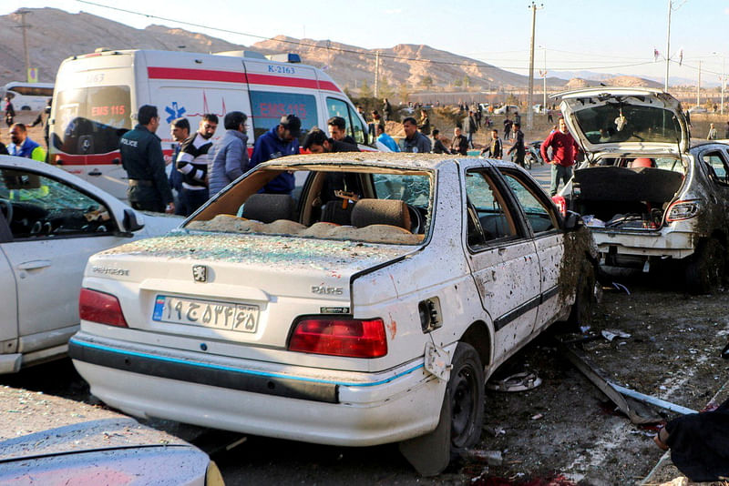 People gather at the scene of explosions during a ceremony held to mark the death of late Iranian General Qassem Soleimani, in Kerman, Iran, on 3 January, 2024