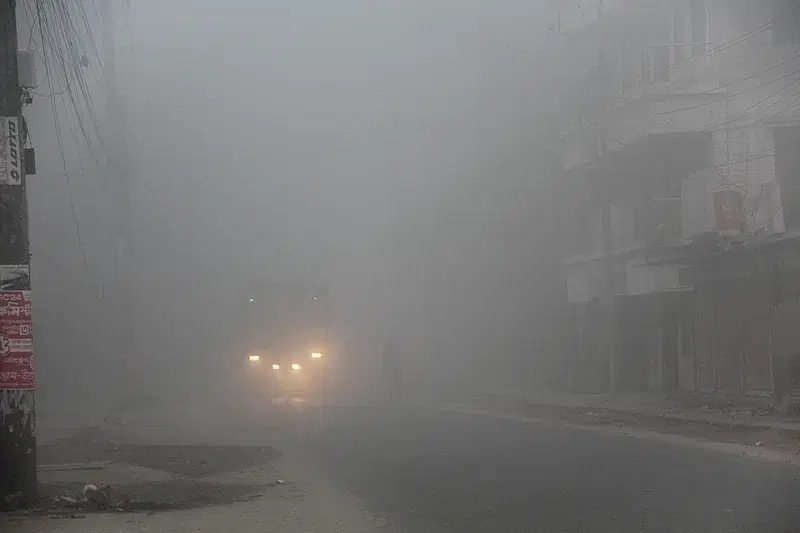 A bus operates with head lights in Chuadanga on at 8:00 am on 23 January in 2024