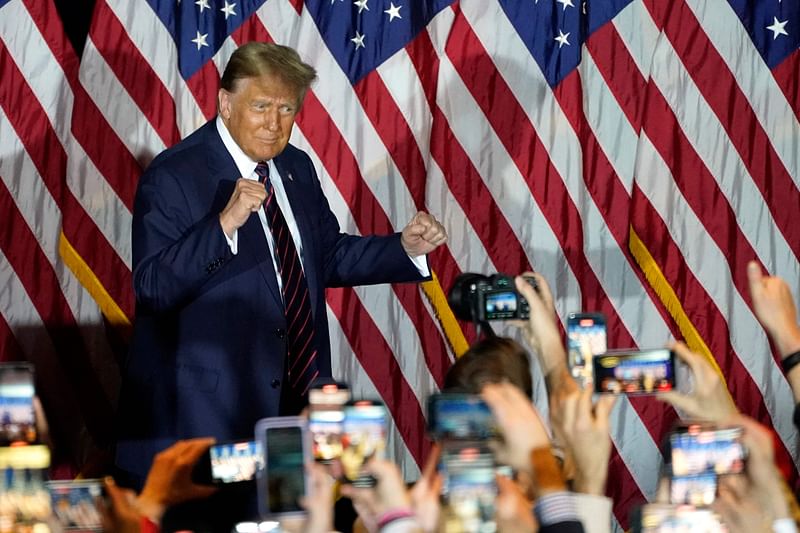 Republican presidential hopeful and former US President Donald Trump gestures during an Election Night Party in Nashua, New Hampshire, on 23 January, 2024