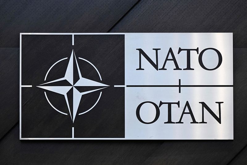 A logo of the North Atlantic Treaty Organization (NATO) is seen during the Nato - Ukraine Council Defence Ministers at the Nato headquarters in Brussels on 15 February, 2024. NATO has "no plans" to send combat troops to Ukraine, an Alliance official told AFP on 27 February, 2024, the day after French President Emmanuel Macron said that sending Western troops could not be ruled out