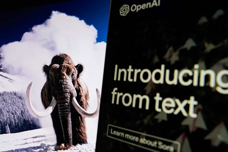 In this photo illustration, a video created by Open AI's newly released text-to-video "Sora" tool plays on a monitor in Washington, DC on 16 February 2024.