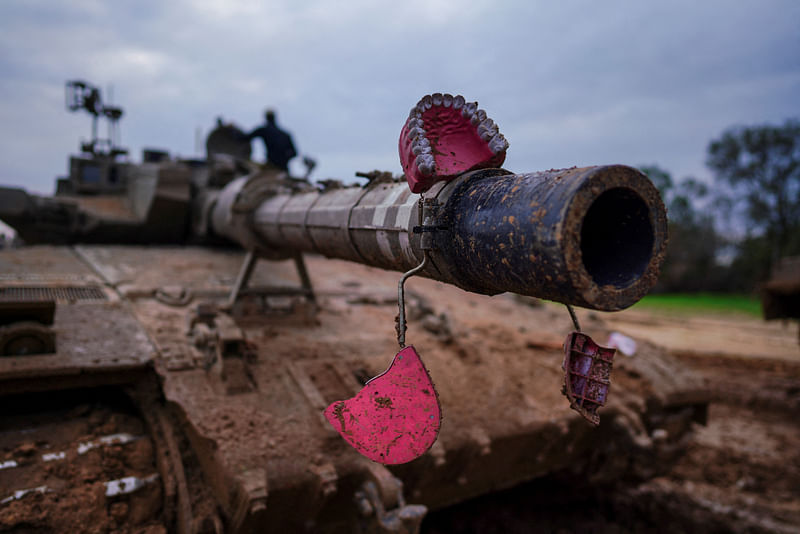 A tank barrel is decorated with a fake denture, amid the ongoing conflict between Israel and Palestinian Islamist group Hamas, at the Israeli border with Gaza, 28 January 2024.