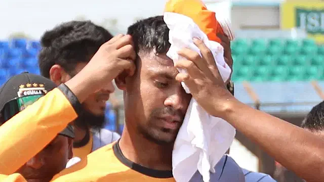 Mustafiz after receiving head injury