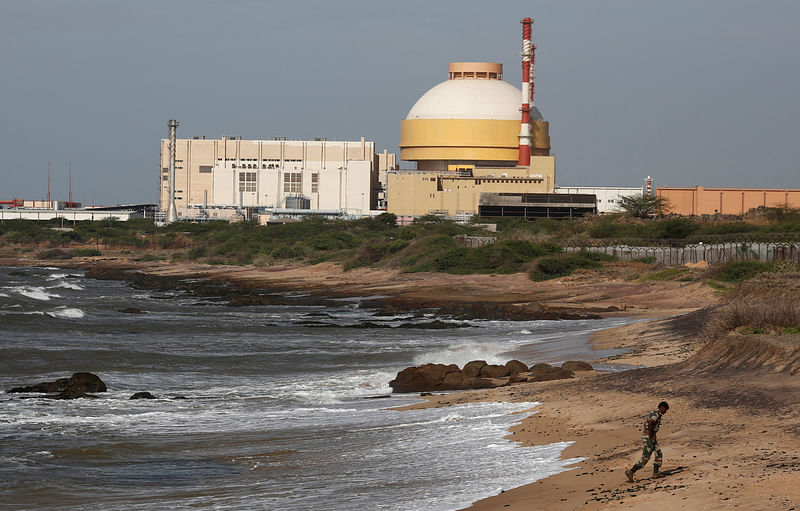 A policeman walks on a beach near the Kudankulam nuclear power project in the southern Indian state of Tamil Nadu on 13 September, 2012