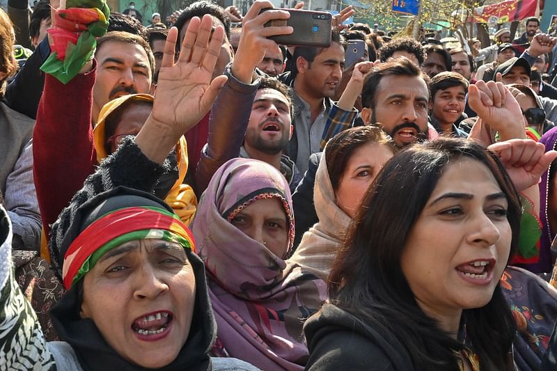 Supporters of the Pakistan Tehreek-e-Insaf (PTI) party shout slogans in a protest outside the office of a Returning Officer (RO) in Islamabad on 11 February  2024, amid claims the election result delay is allowing authorities to rig the vote-counting.