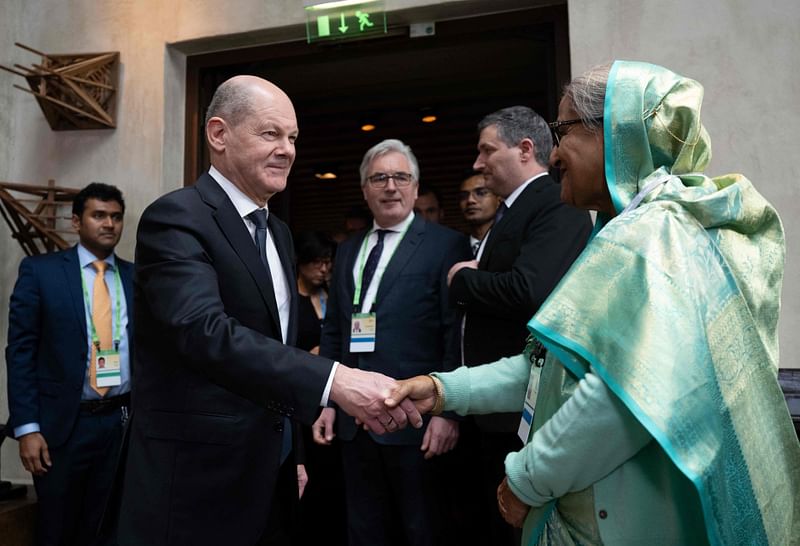 German Chancellor Olaf Scholz (L) and Prime Minister of Bangladesh Sheikh Hasina meet on the sidelines of the Munich Security Conference (MSC) at the Bayerischer Hof hotel in Munich, southern Germany, on 17 February, 2024. The 60th Munich Security Conference (MSC) will run from 16 to 18 February, 2024