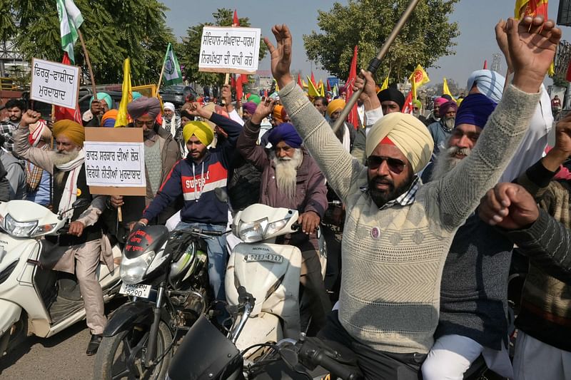 Farmers shout slogans during a protest demanding minimum crop prices in Amritsar on 13 February, 2024.