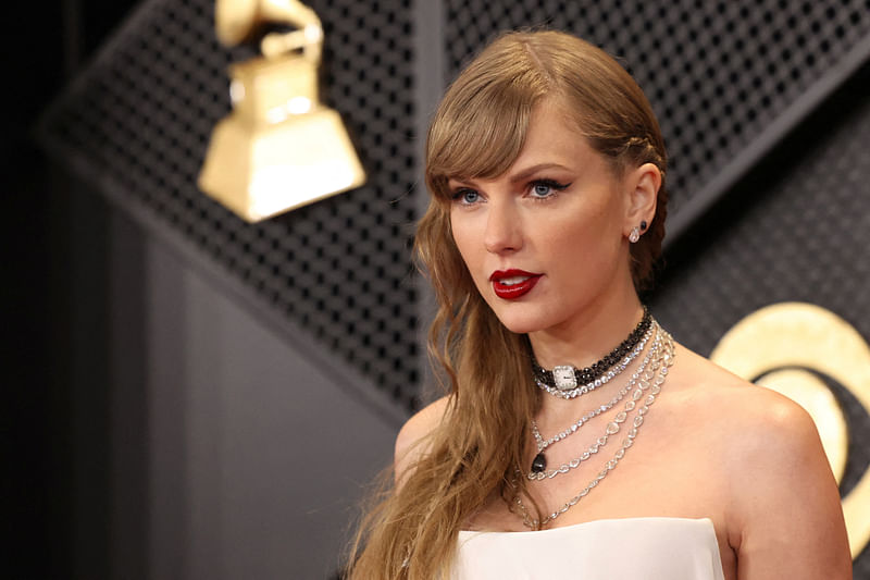 Taylor Swift poses on the red carpet as she attends the 66th Annual Grammy Awards in Los Angeles, California, US, 4 February, 2024.