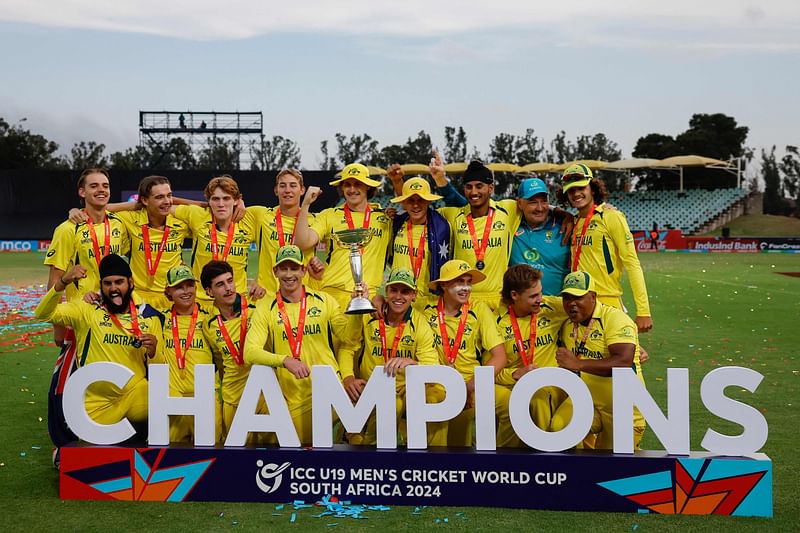 Australia players pose for a photo with the trophy after winning the under-19 World Cup youth one-day international (YODI) final between India and Australia at Willowmoore Park in Benoni on 11 February, 2024