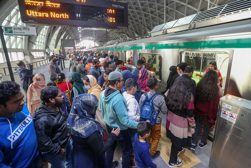 Commuters board on a train at Motijheel station of the Dhaka metro rail on 20 January 2024. Sazid Hossain