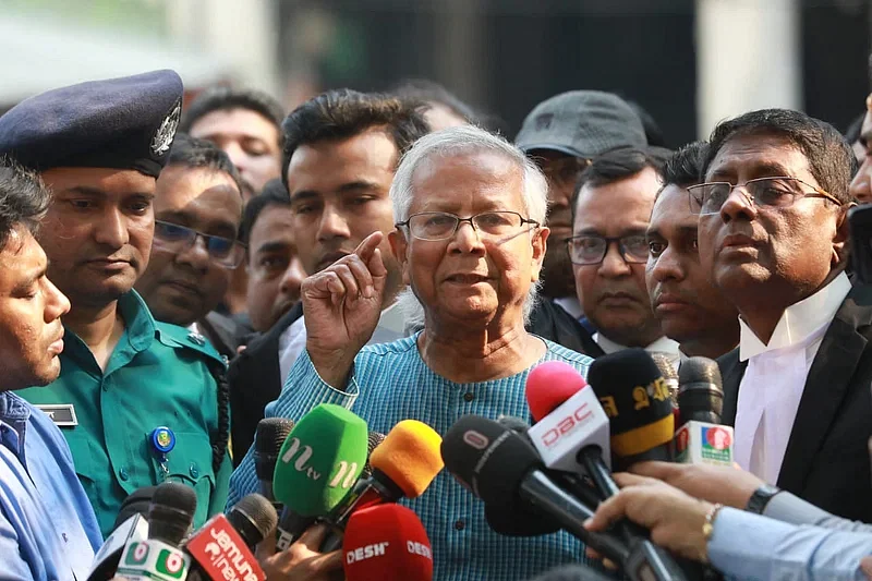 Nobel Peace Prize winner Dr Muhammad Yunus talks to the media after getting bail from a court on 3 March in 2021