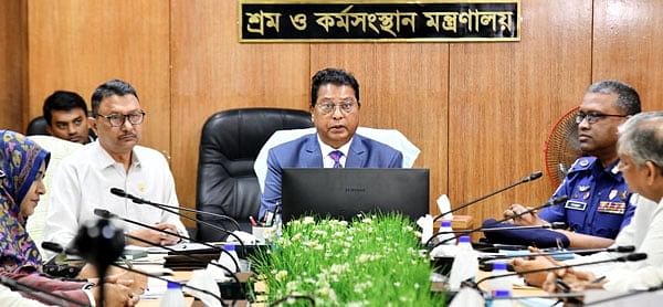 State Minister for Labour and Employment Md. Nazrul Islam Chowdhury addresses a meeting