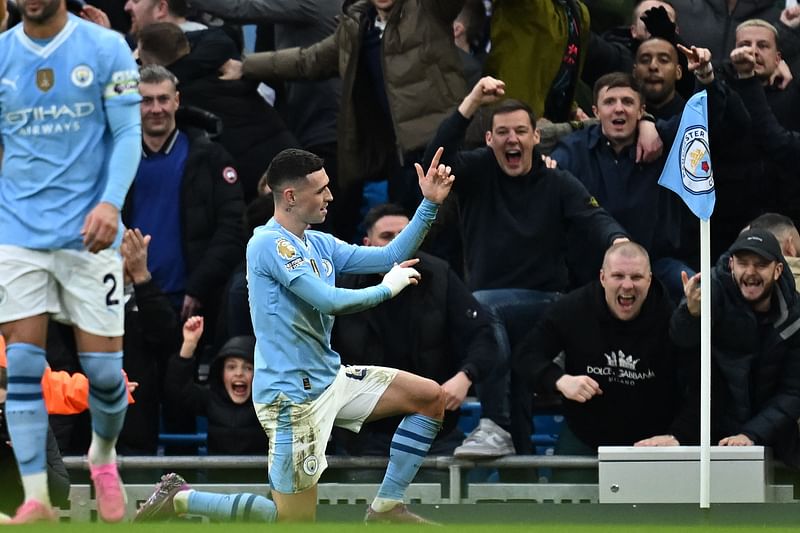 Manchester City's English midfielder #47 Phil Foden celebrates after scoring their second goal during the English Premier League football match between Manchester City and Manchester United at the Etihad Stadium in Manchester, north west England, on March 3, 2024