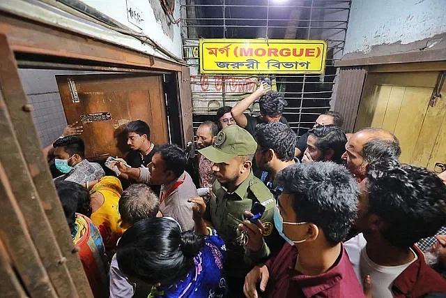 People crowd the Dhaka Medical College Hospital morgue in search of their missing relatives.