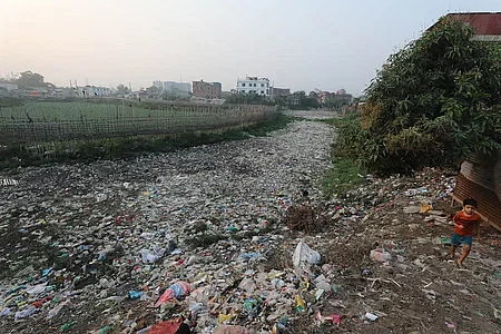 According to Dhaka North City Corporation document, this curve route is identified as a portion of Kalyanpur water body. Accordingly, this area is supposed to contain water. But the waterbody is covered with litter. The Picture was taken from Gabtali embankment area on Friday.