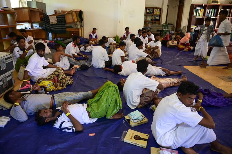 Newly arrived Rohingya refugees rest at the former Red Cross Indonesia office building in Meulaboh, West Aceh, on 22 March, 2024