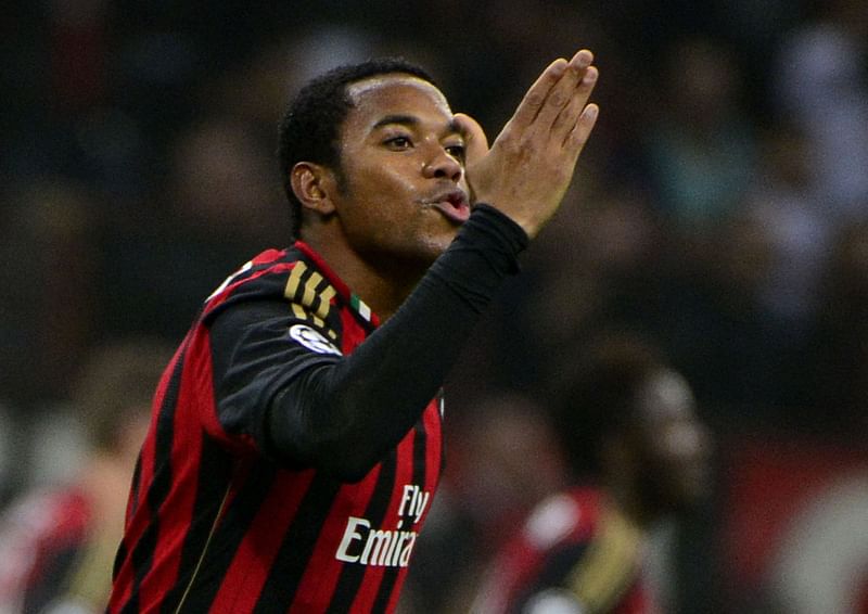 AC Milan’s Brazilian forward Robinho celebrates after scoring during the Champion’s League football match AC Milan vs FC Barcelona, on 22 October, 2013 in San Siro Stadium in Milan