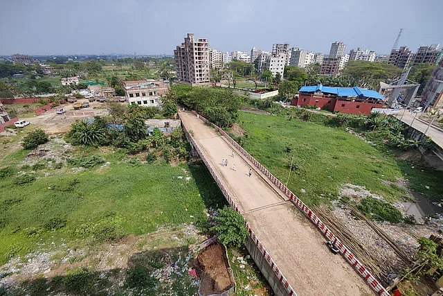 It may look like a field, but it's actually a canal. It has been filled with garbage and taken on this shape. The local people call it the dead canal, officially it's called Manda. East Manda of Mugda under Dhaka South City, Friday afternoon