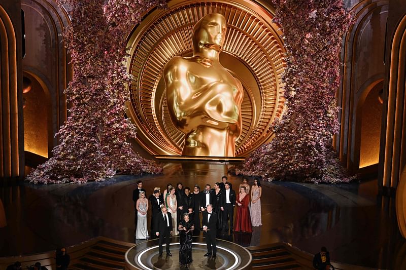 Producers of "Oppenheimer" British film producer Emma Thomas (C), US film producer Charles Roven (L) and British filmmaker Christopher Nolan accept the award for Best Picture onstage during the 96th Annual Academy Awards at the Dolby Theatre in Hollywood, California on March 10, 2024