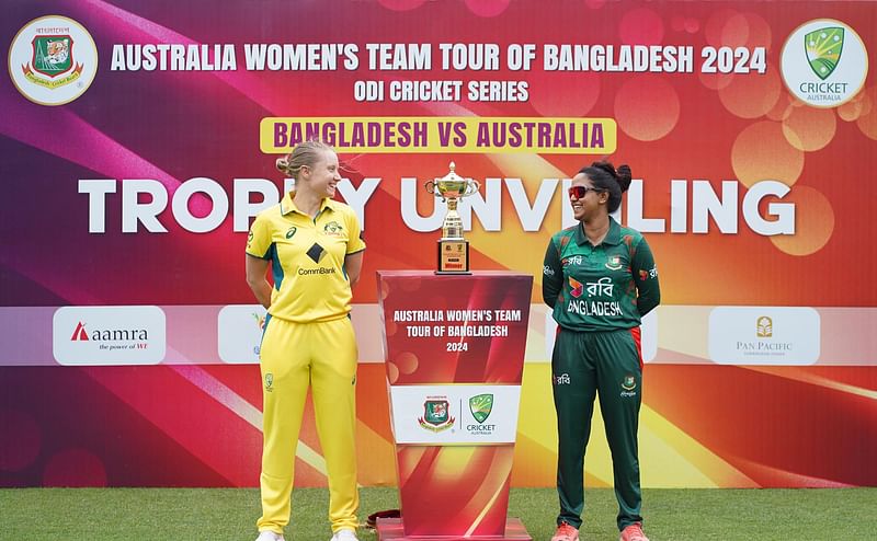 Bangladesh and Australia women's teams captains pose with the ODI trophy