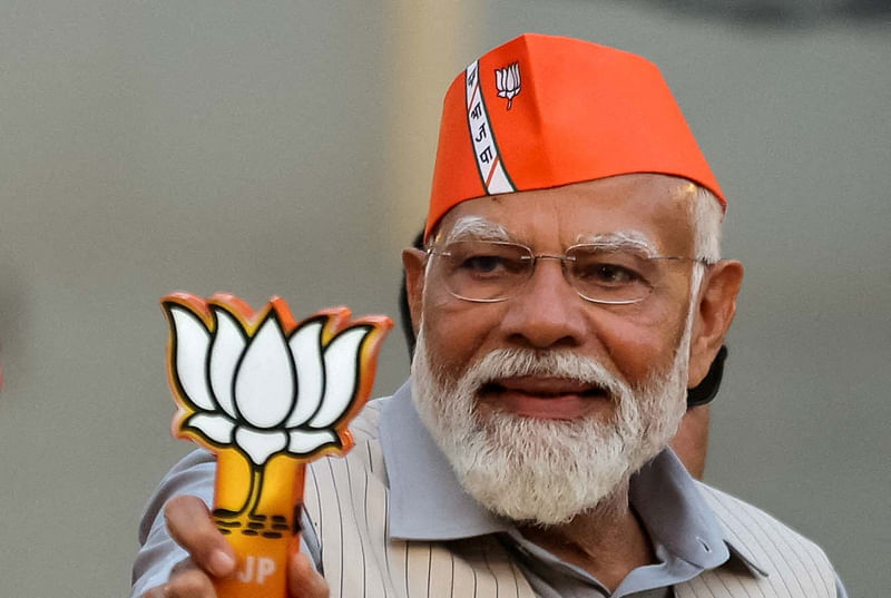 India’s Prime Minister Narendra Modi greets supporters during his roadshow, ahead of the general elections, in Ghaziabad, India, on 6 April, 2024